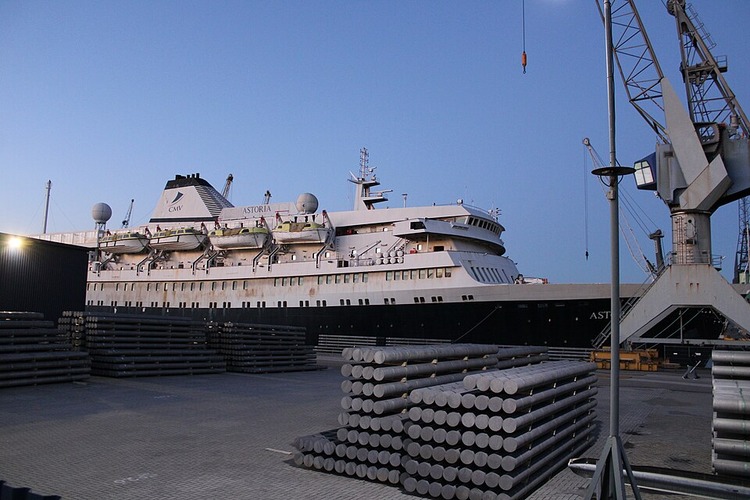 An image of a worn cruise ship in port.
