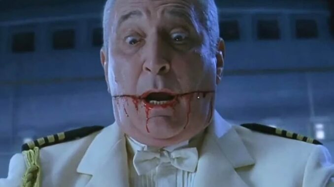 A man in a white ship captain's uniform.