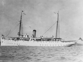 A black and white photo of a military ship.