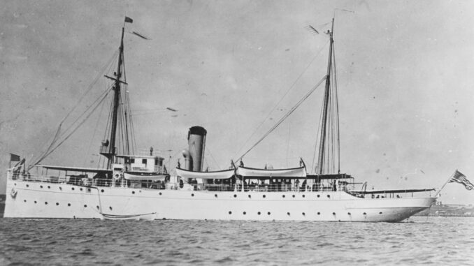 A black and white photo of a military ship.