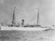 A black and white photo of a military ship.